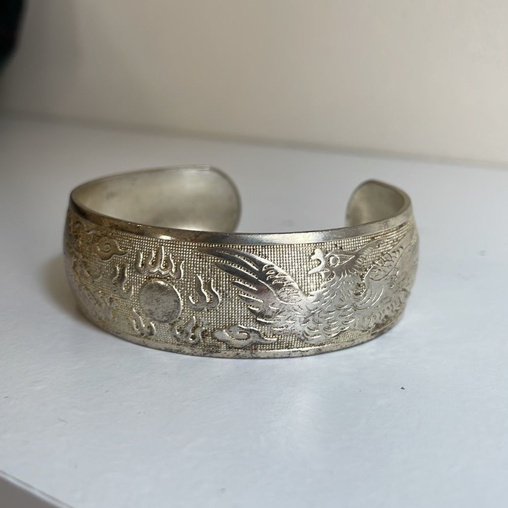 Cuff, bought in China, Chinese imagery, dragons, fire